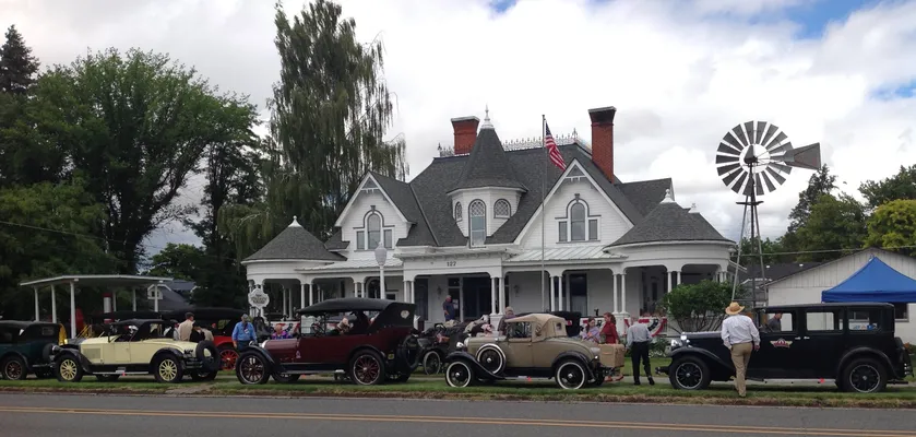 Antique cars parked in front of the museum