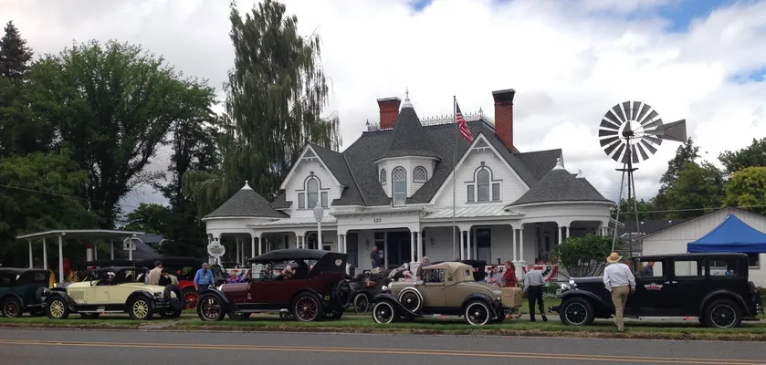 Antique cars parked in front of the museum